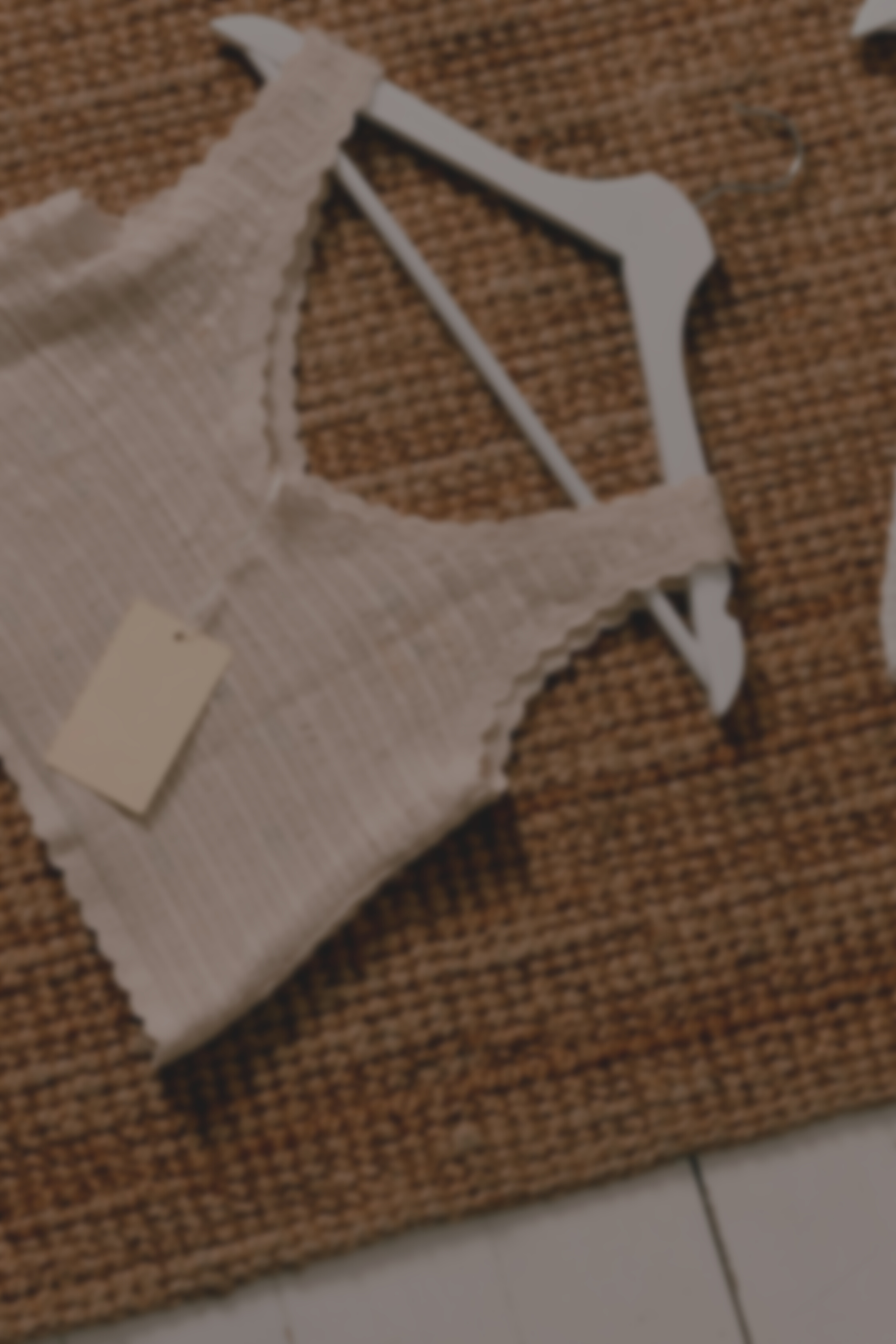 Woven Blouse with Tag in a Hanger Flatlay